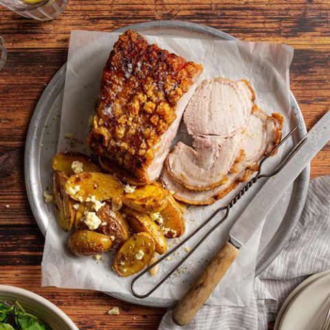 Crackled pork with herby potatoes